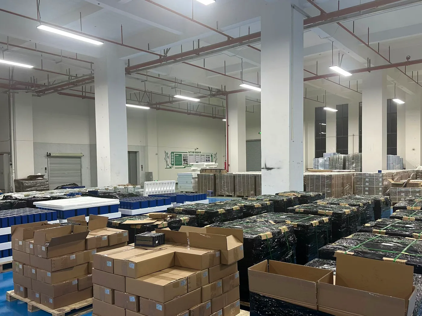 Real lithium battery workshop with bulk cells and packed products
