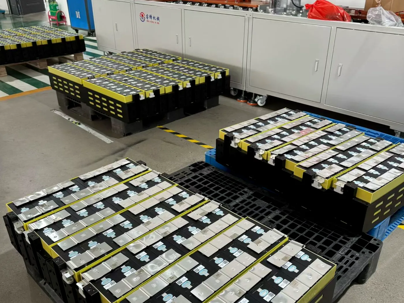 Industrial lithium battery modules arranged near production equipment